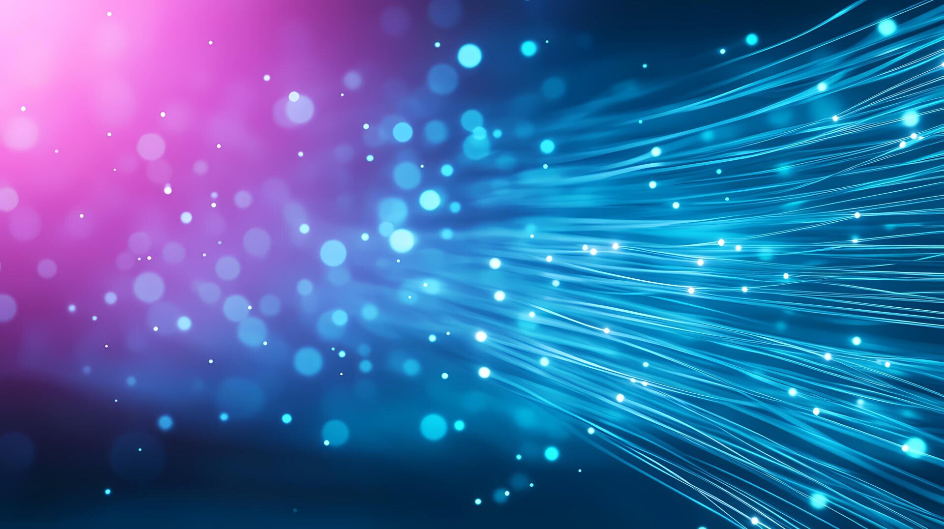 Abstract image featuring glowing blue fiber optic lines and bokeh light spots on a blue and pink gradient background, creating a sense of motion and digital connectivity.